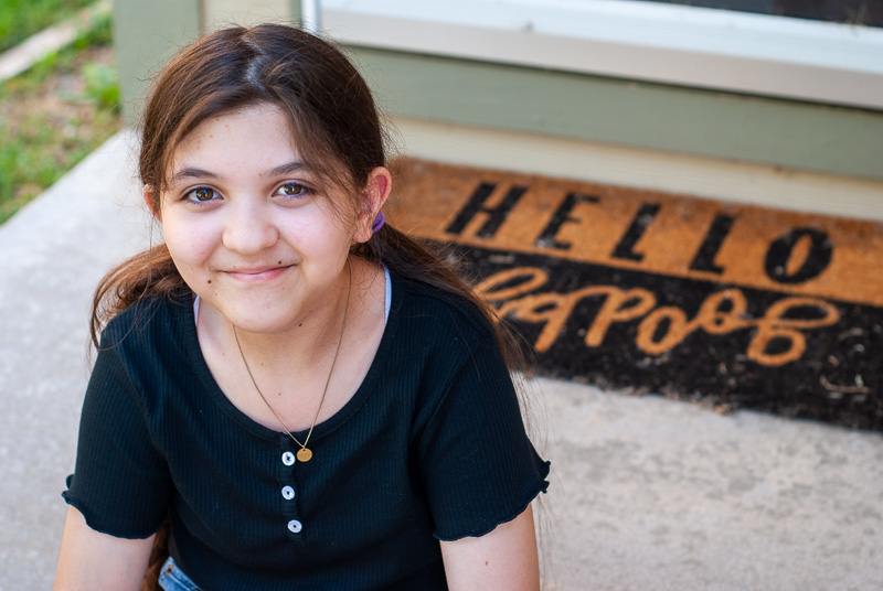 Laney, sitting on the front porch, now